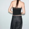 Top à paillettes et encolure dos nu