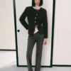 Veste bouclée avec boutons bijoux
