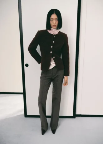 Veste bouclée avec boutons bijoux