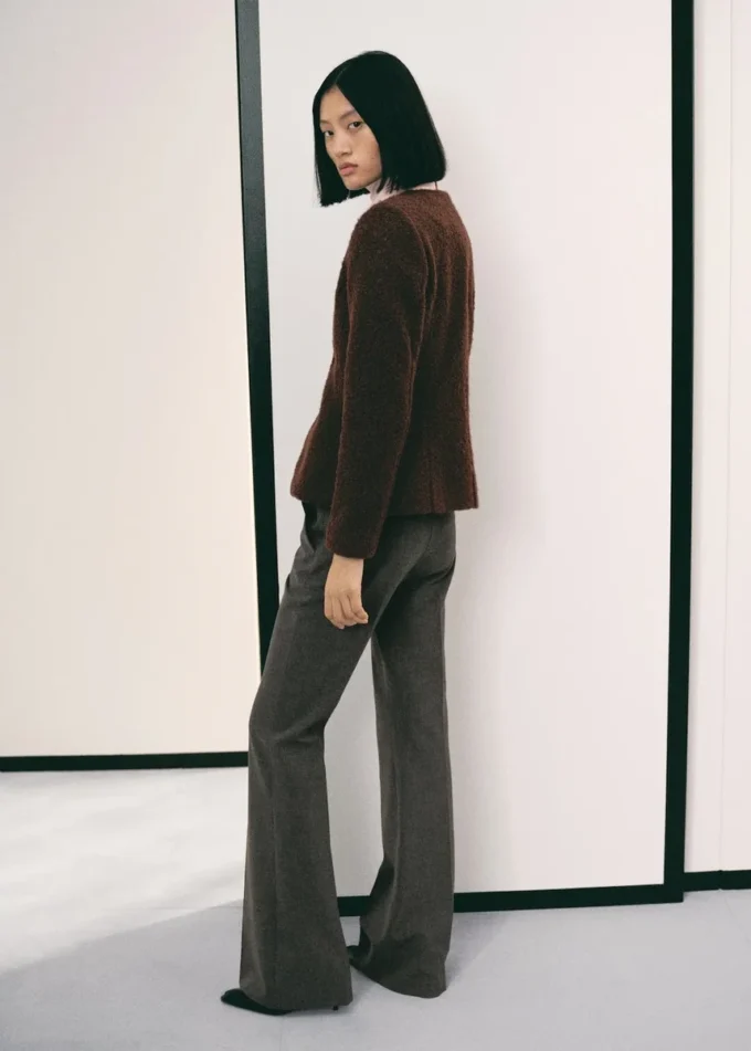 Veste bouclée avec boutons bijoux