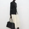 Veste à col montant et boutons bijoux