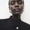 Veste à col montant et boutons bijoux