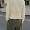 Veste en maille avec ceinture et boucle