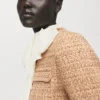 Veste en tweed avec bords effilochés