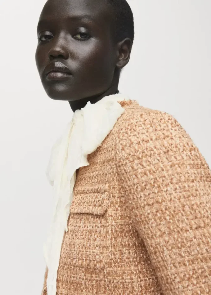 Veste en tweed avec bords effilochés