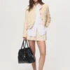 Veste en tweed avec boutons bijoux