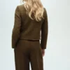 Veste en tweed avec boutons bijoux