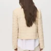 Veste en tweed avec boutons bijoux