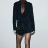 Veste en velours avec paillettes et nœud
